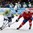 OSTRAVA, CZECH REPUBLIC - MAY 8: Slovenia's Marcel Rodman #22 stickhandles the puck with pressure from Norway's Andreas Stene #11 and Daniel Sorvik #90 during preliminary round action at the 2015 IIHF Ice Hockey World Championship. (Photo by Andrea Cardin/HHOF-IIHF Images)

